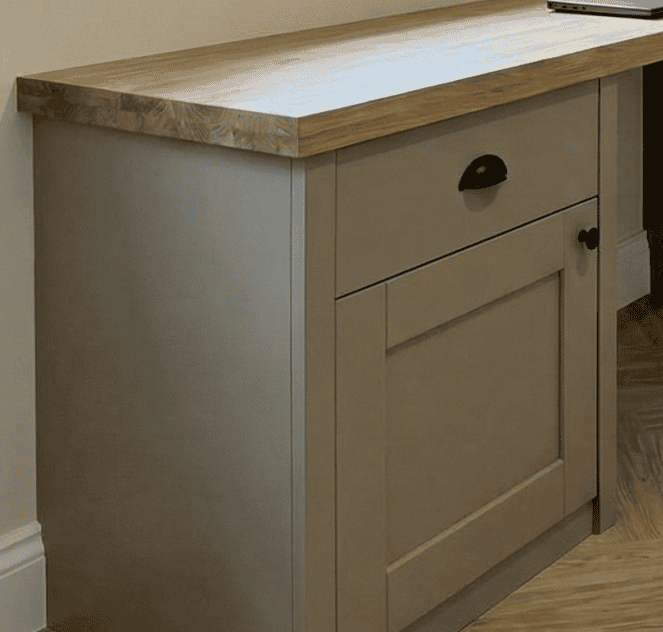 Under stairs storage in panelled wood effect pulled out for show